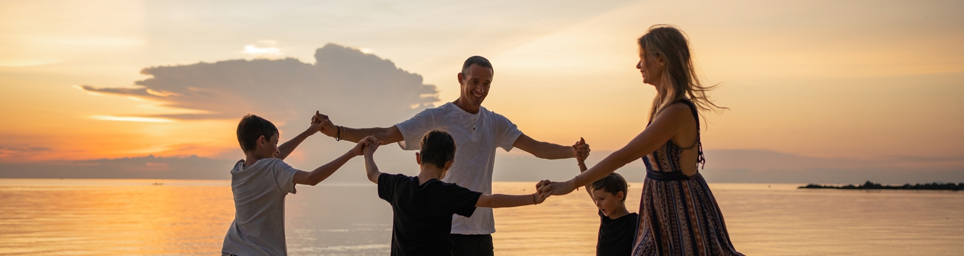 Family having fun on the beach 